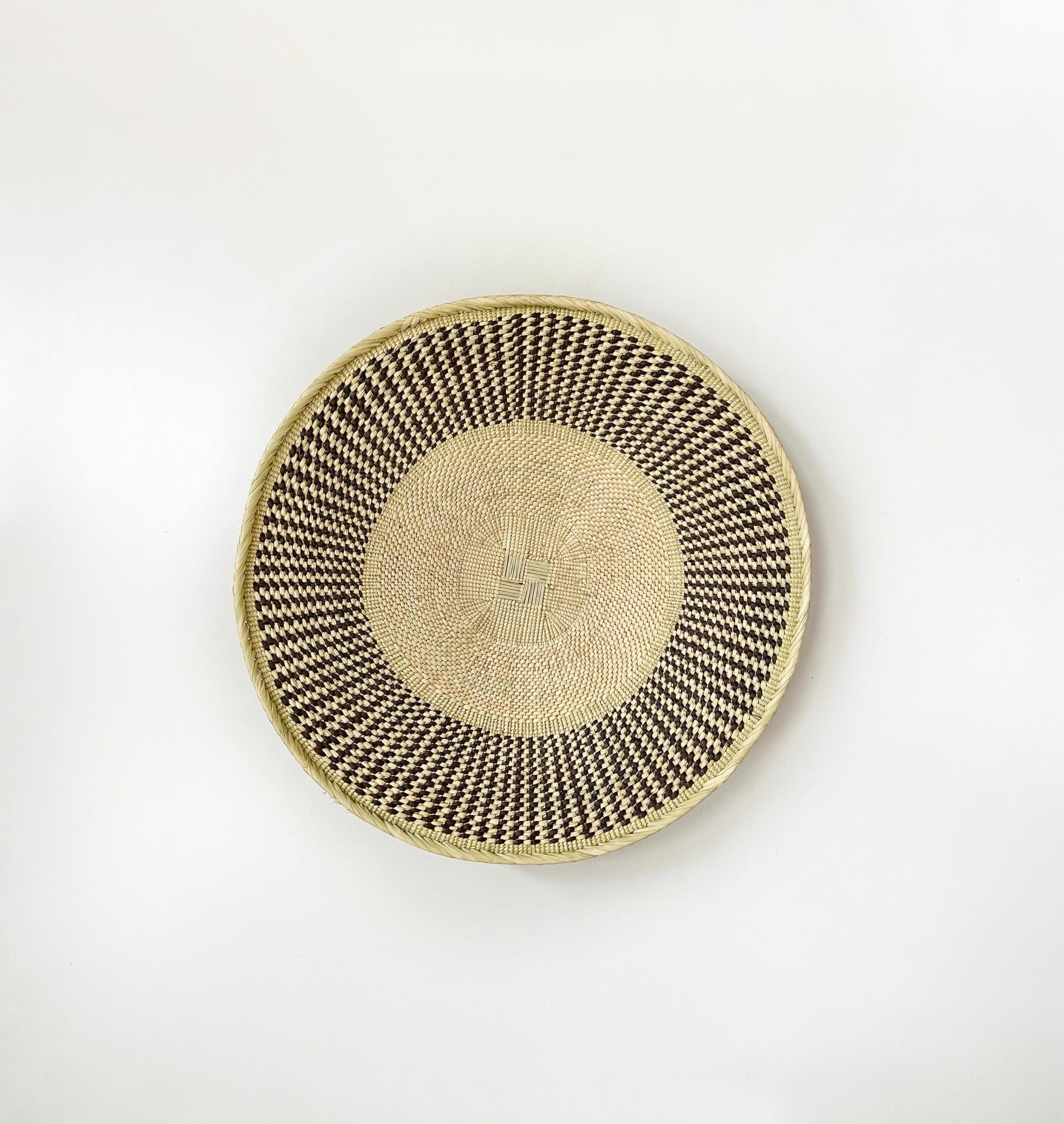 21 inch natural beige wall basket with textured brown pattern around the rim. African wall basket, Binga basket