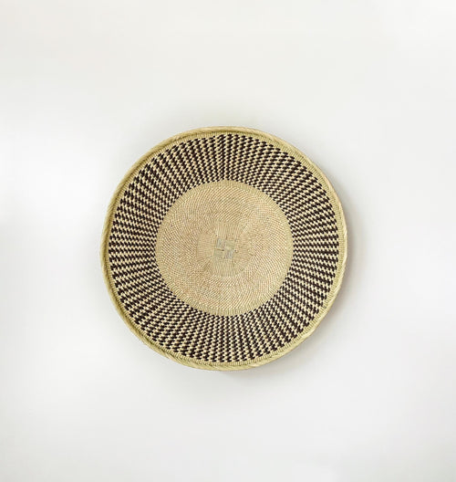 21 inch natural beige wall basket with textured brown pattern around the rim. African wall basket, Binga basket