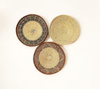 set of 3 rustic woven baskets for wall decor. Medium size - 15 nch, beige with textured geometric patterns around the rim. Handmade in africa